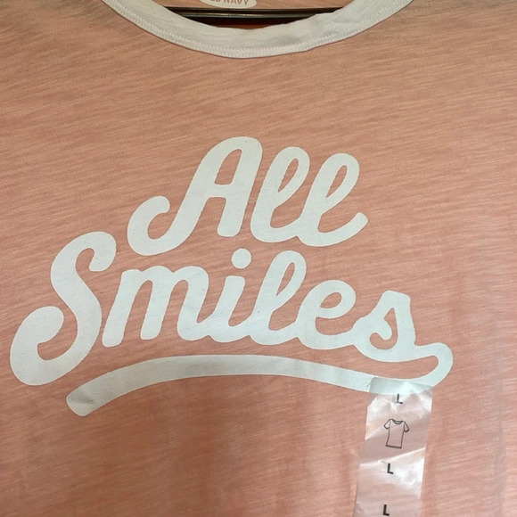 NWT Old Navy Sz L tshirt. Peachy pink with “All Smiles” on front. White detail. - Picture 3 of 5